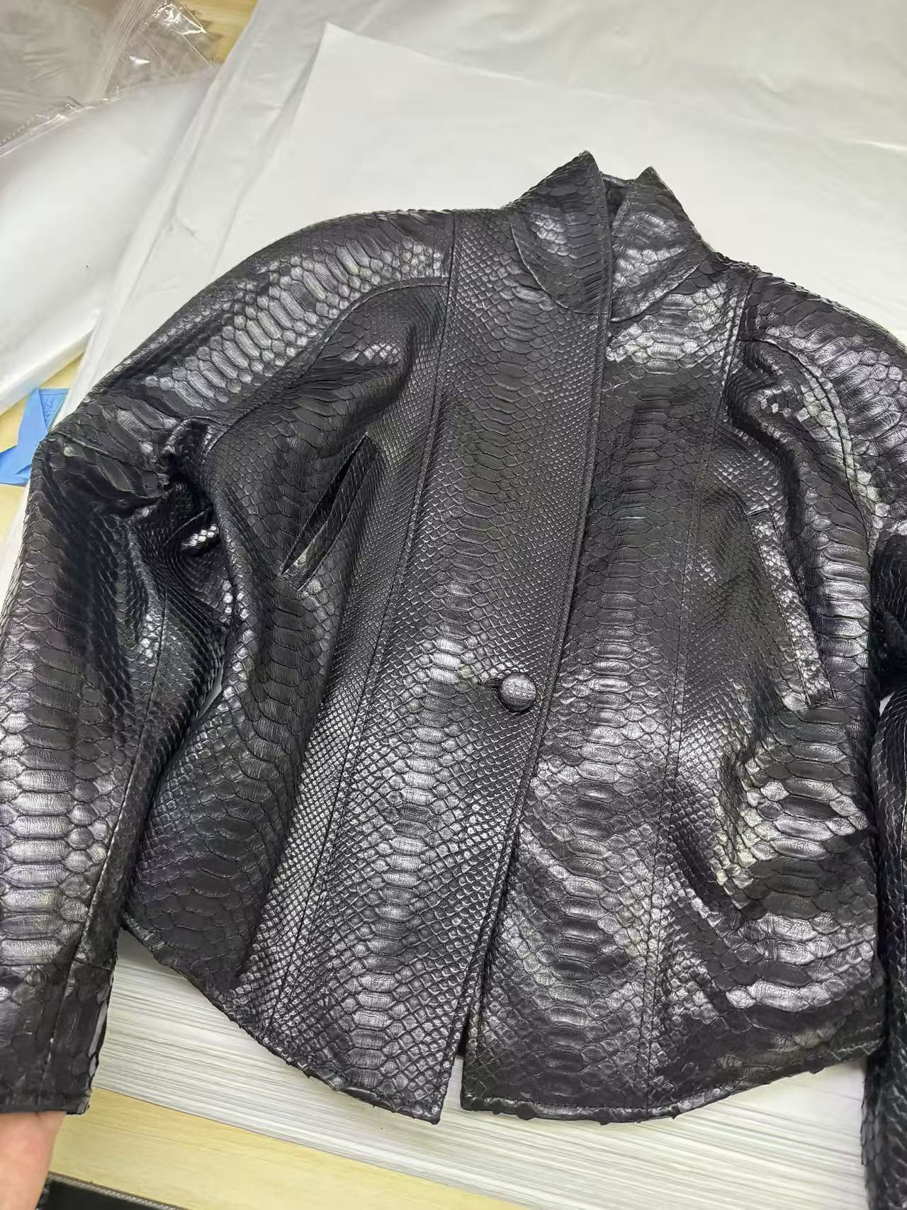 A finished textured leather blazer.