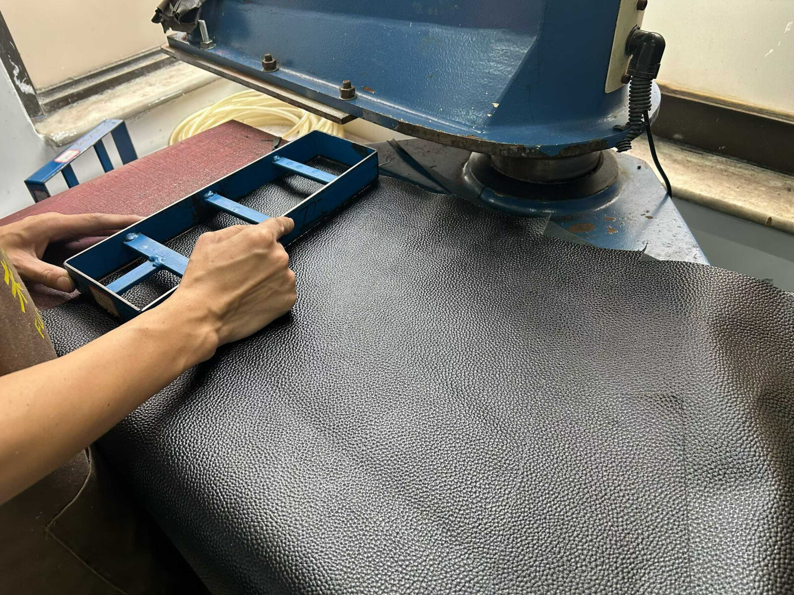 Leather workshop equipment in use.